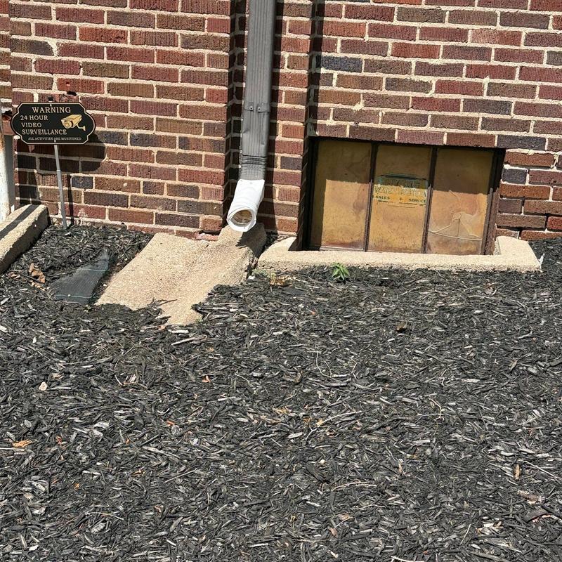 Downspout extension with concrete splash block
