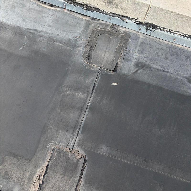 Carlisle EPDM roofing membrane patch repair close-up Carlisle EPDM roofing membrane patch repair close-up