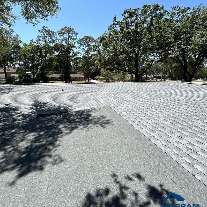 Architectural shingle roof with modified bitumen flat section Architectural shingle roof with modified bitumen flat section