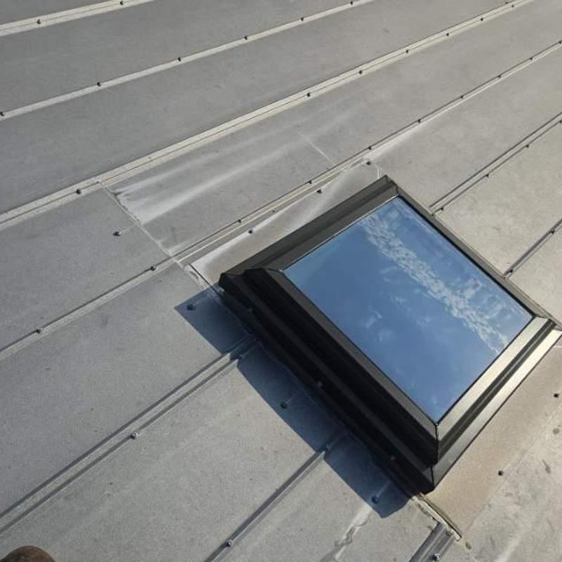 5V crimp metal roof with impact-rated skylight installation 5V crimp metal roof with impact-rated skylight installation