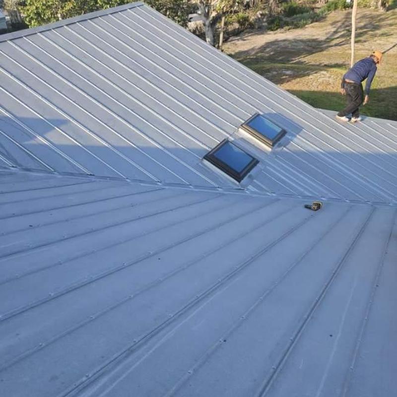 5V crimp metal roof with impact-rated skylights installation 5V crimp metal roof with impact-rated skylights installation