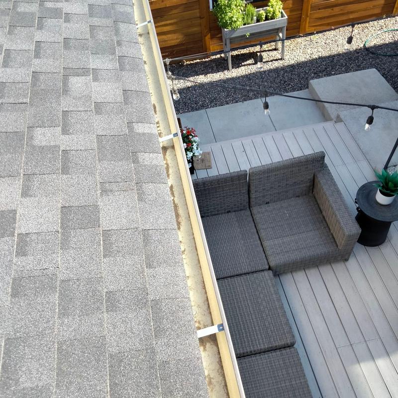Gutter cleaning with debris removal on shingle roof Gutter cleaning with debris removal on shingle roof
