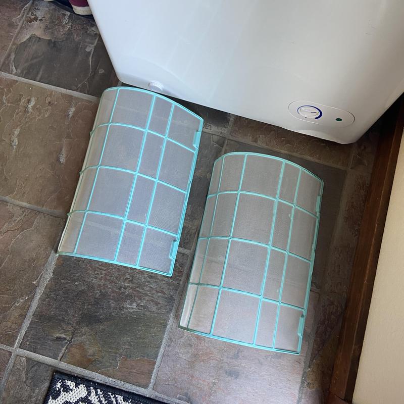 HVAC air filters removed for cleaning on floor HVAC air filters removed for cleaning on floor