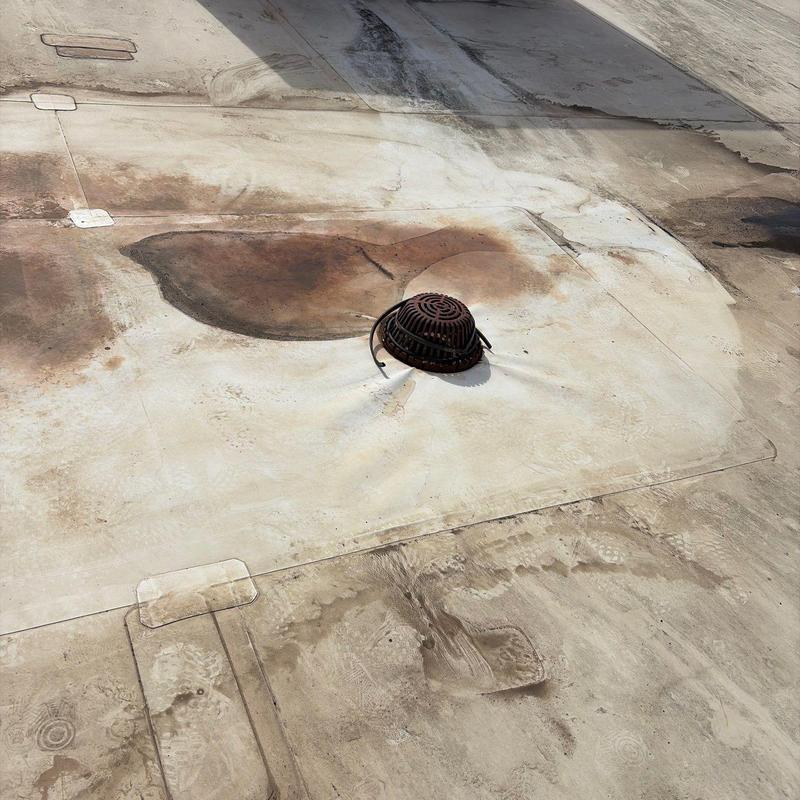 Single ply roof drain with rust and stains