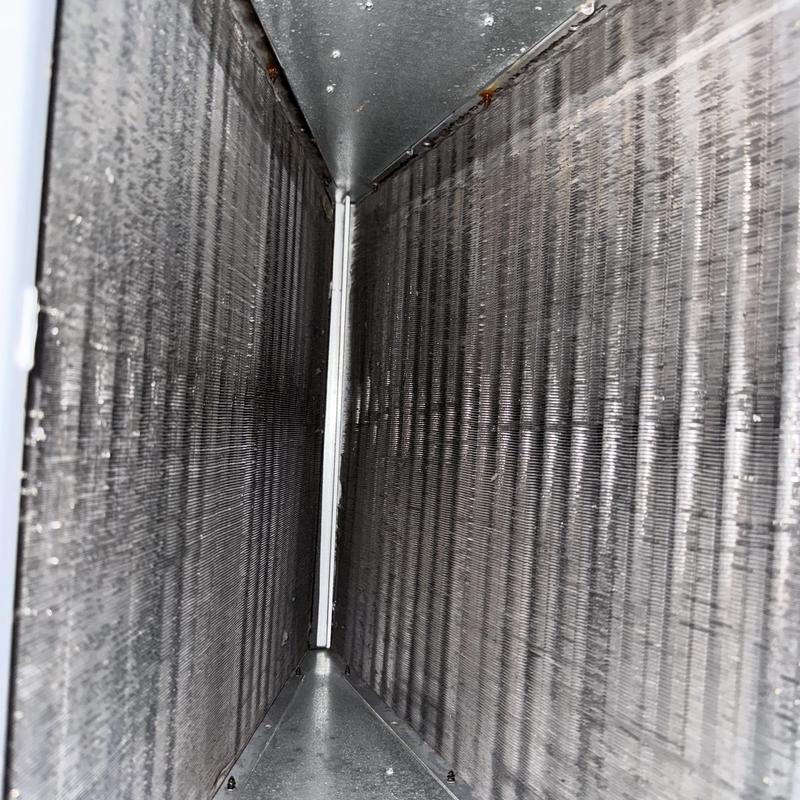 Evaporator coil inside HVAC unit close-up view Evaporator coil inside HVAC unit close-up view