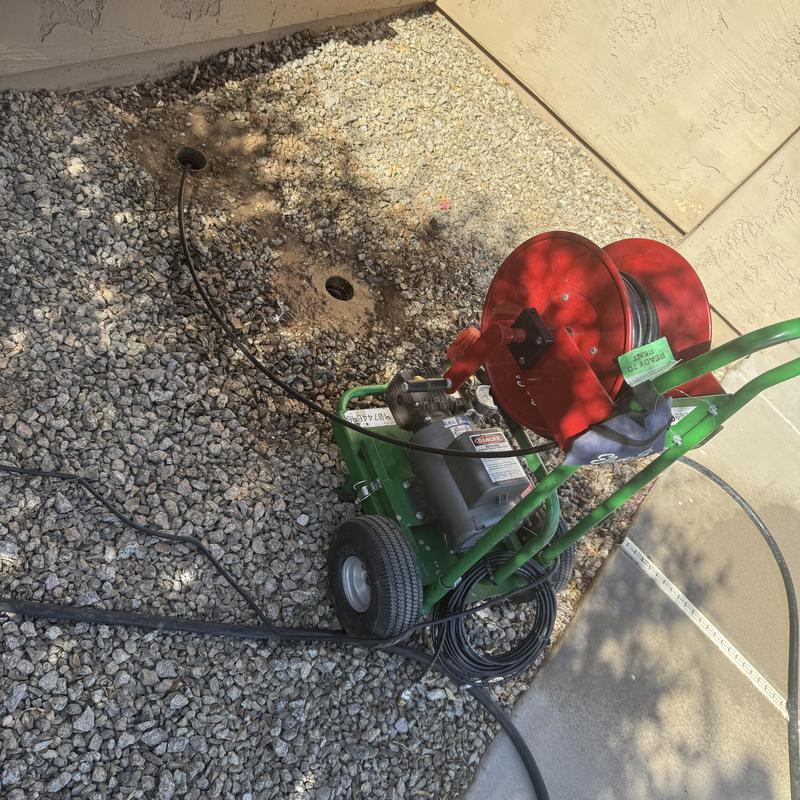 Sewer mainline jetting machine with hose reel