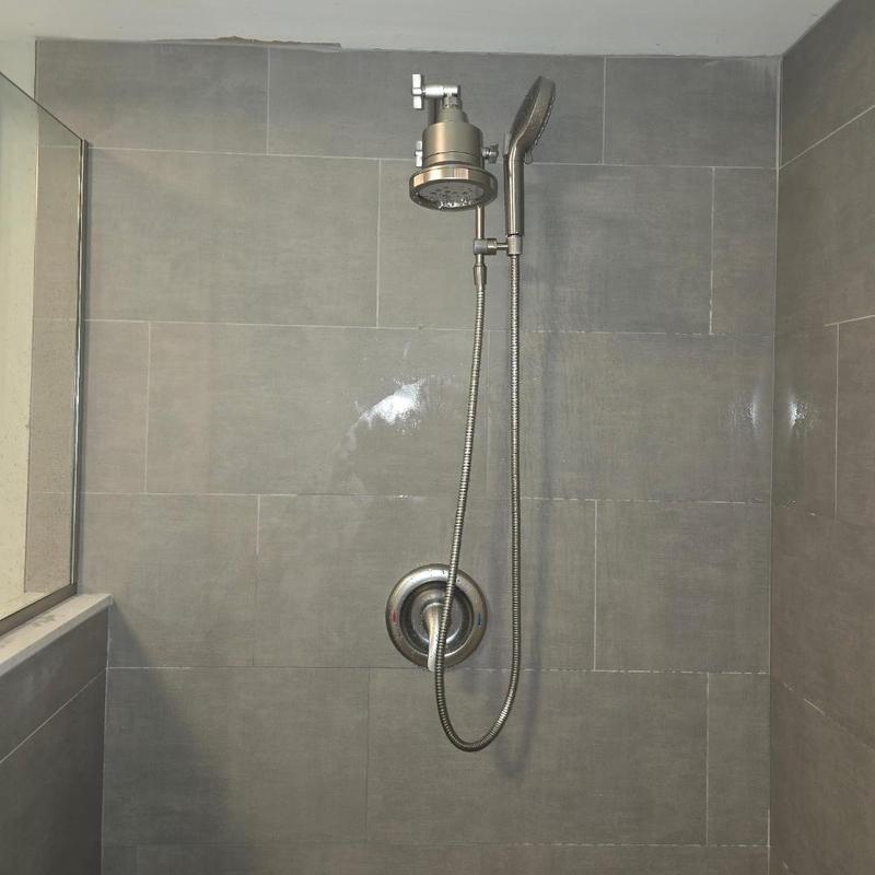 Shower head and handheld sprayer installation in tiled shower