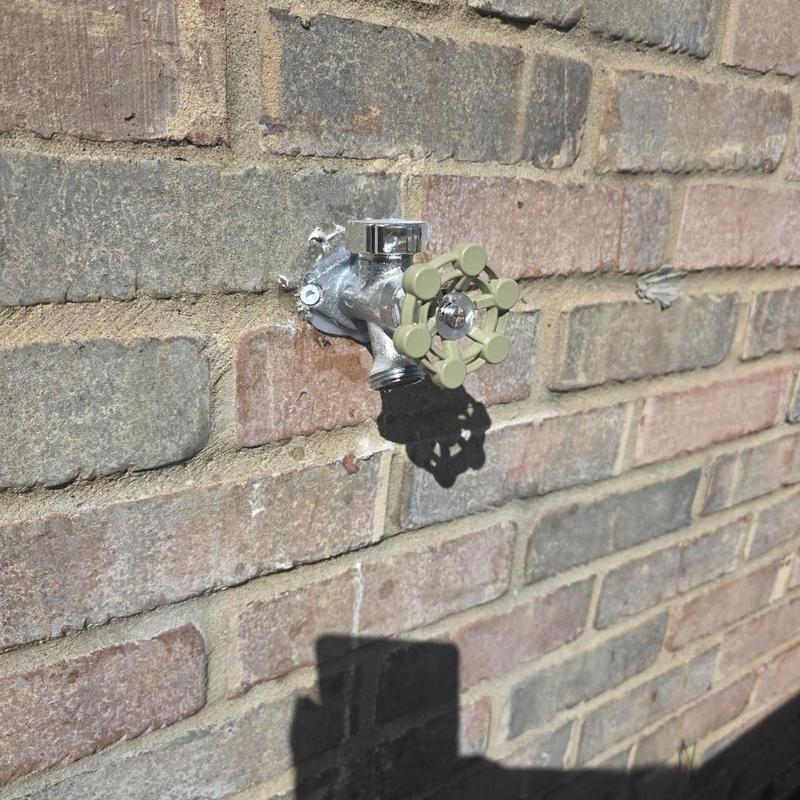 Frost-free hose bib installed on brick wall