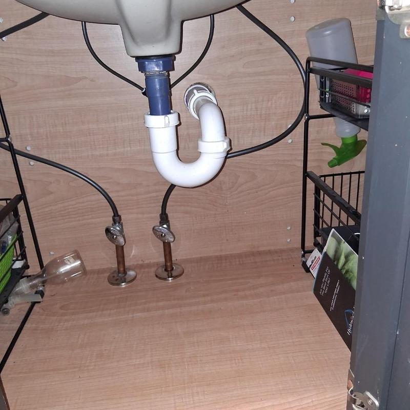 Lavatory drain trap and supply valves under sink