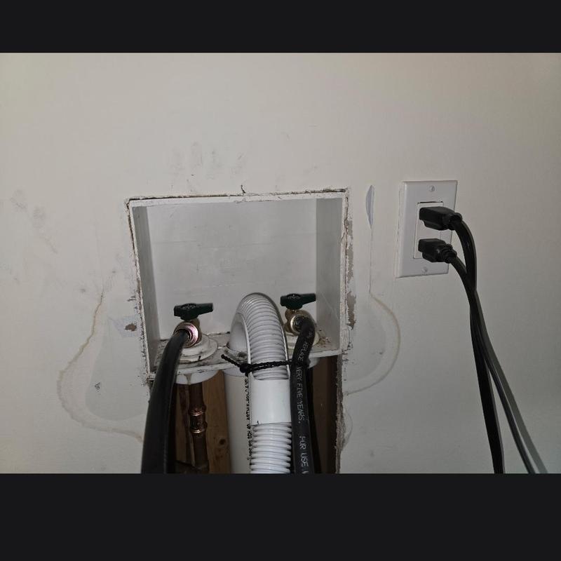 Washer supply valves and hoses in cut drywall opening