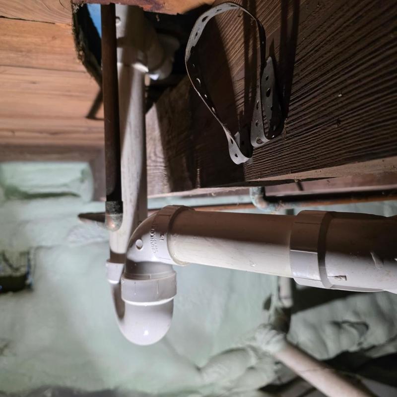 Toilet drain pipe with watco sealing strap installed