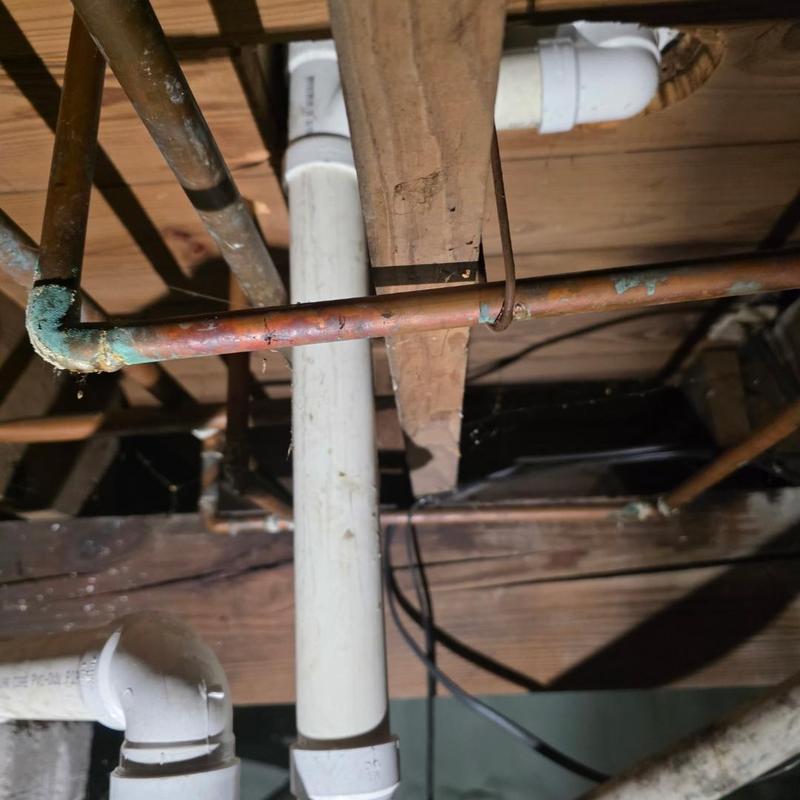 Copper water piping corrosion under floor joists