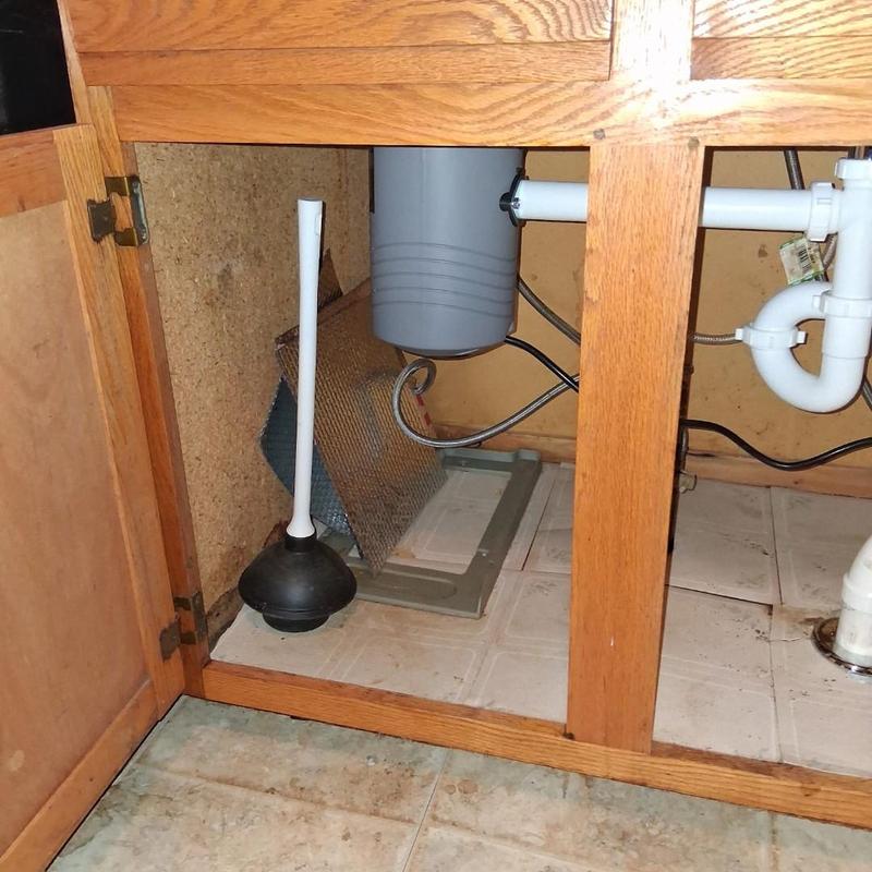 Garbage disposal and under sink plumbing pipes