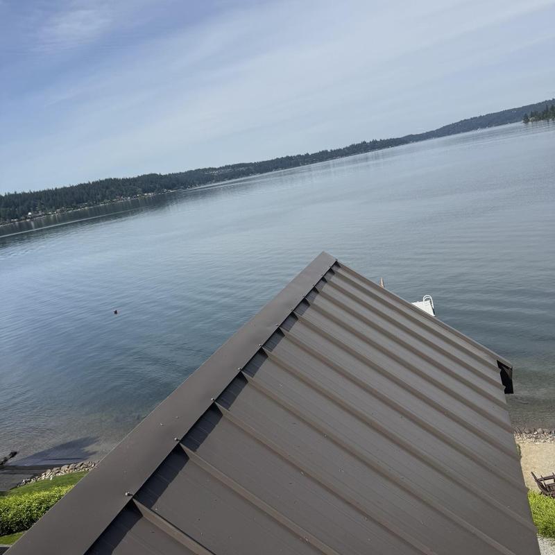 Metal roof cleaning and pressure washing near lake