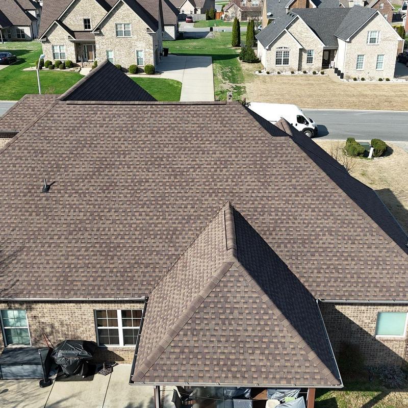 Asphalt shingle roof with visible hail damage inspection