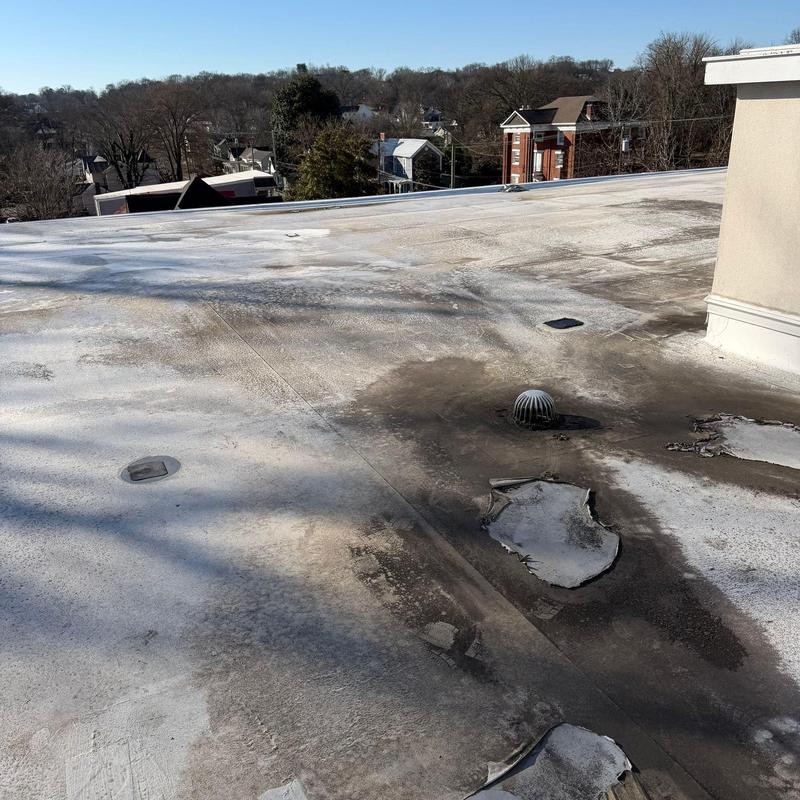 TPO roofing membrane with hail damage and drainage vent