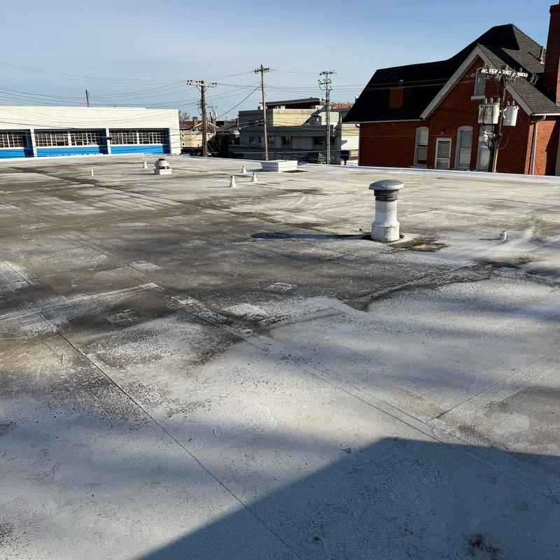 TPO roofing membrane with hail damage and rooftop vents