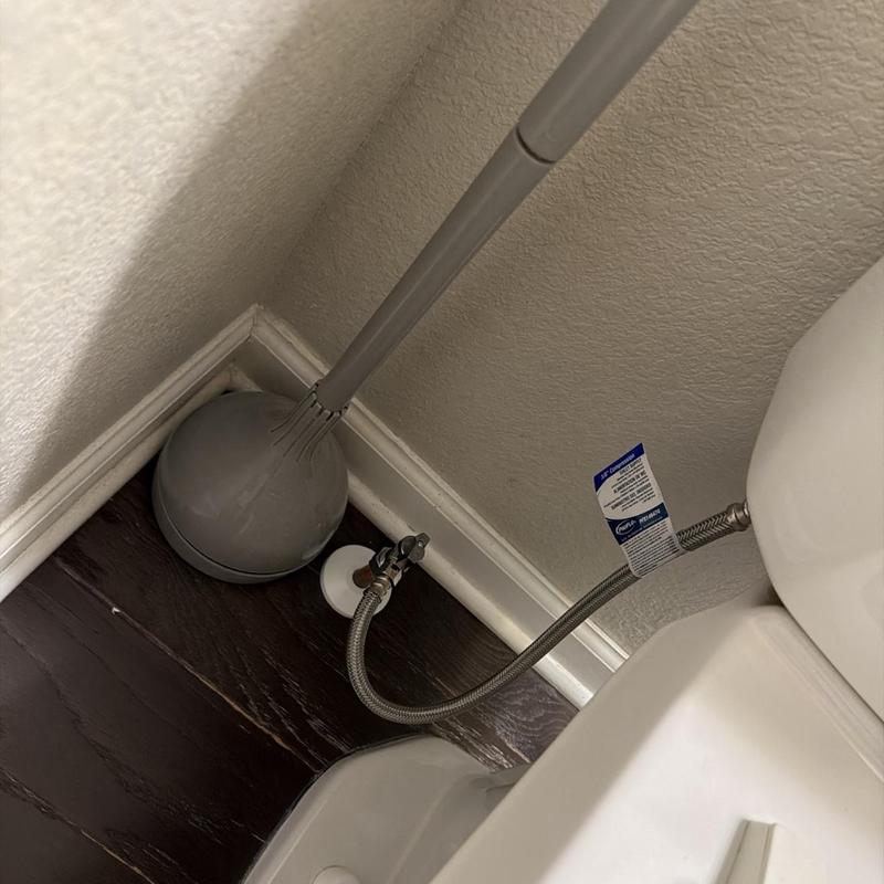 Quarter-turn angle stop with braided supply line near toilet Quarter-turn angle stop with braided supply line near toilet