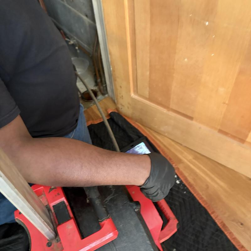 Drain line jetting with inspection camera in utility area Drain line jetting with inspection camera in utility area