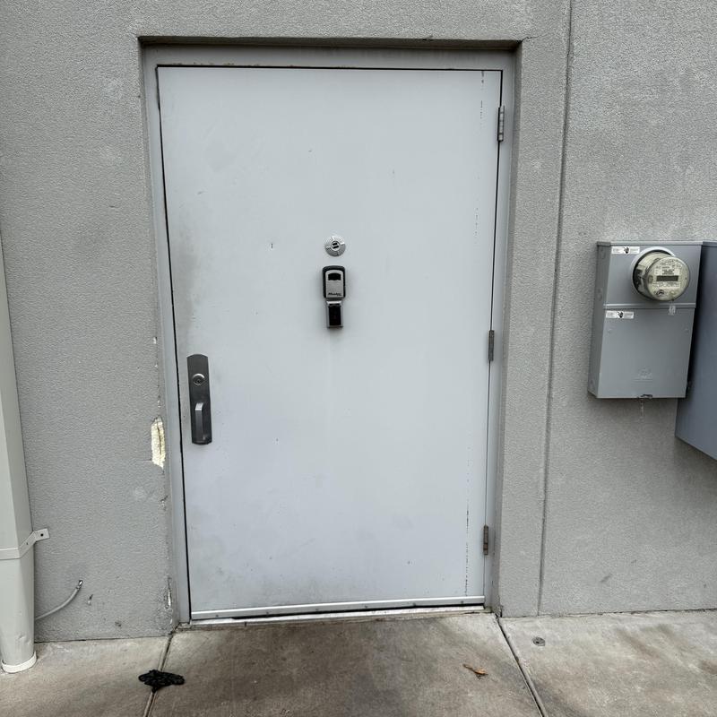 Delivery door with damaged hinges and frame clearance issue