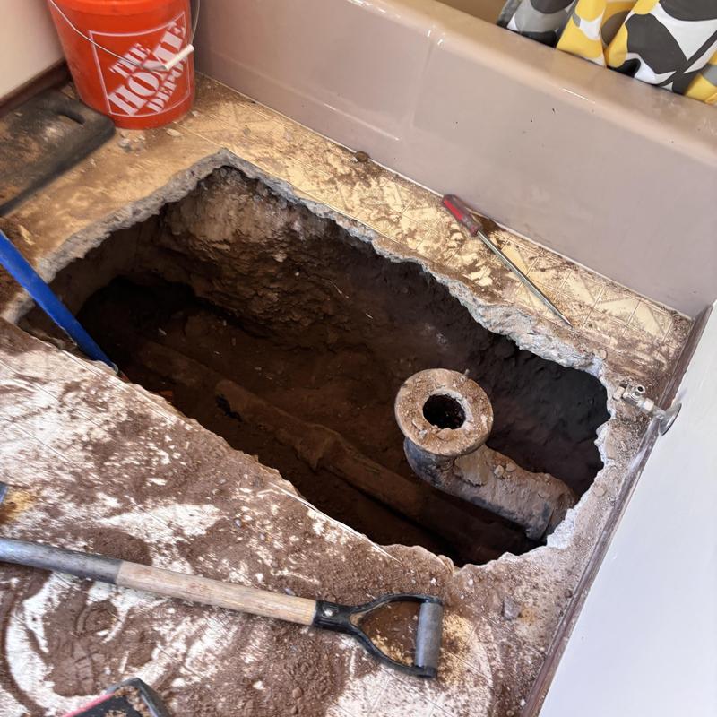 Cast iron drain pipe exposed during bathroom floor repipe