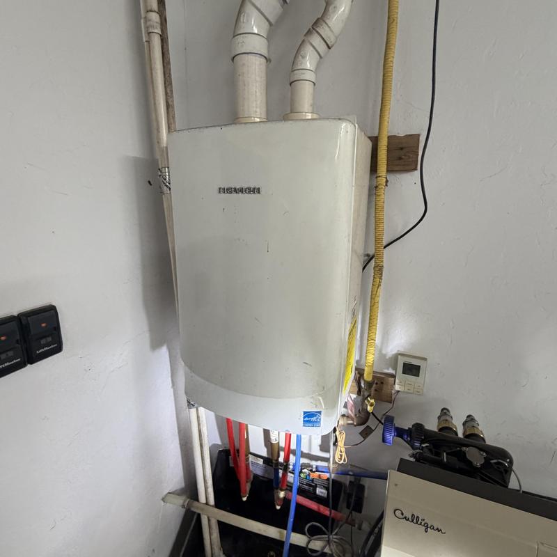 Navien tankless water heater with plumbing connections Navien tankless water heater with plumbing connections