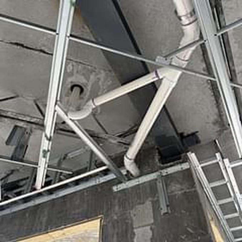 PVC drain pipes installation in ceiling framework