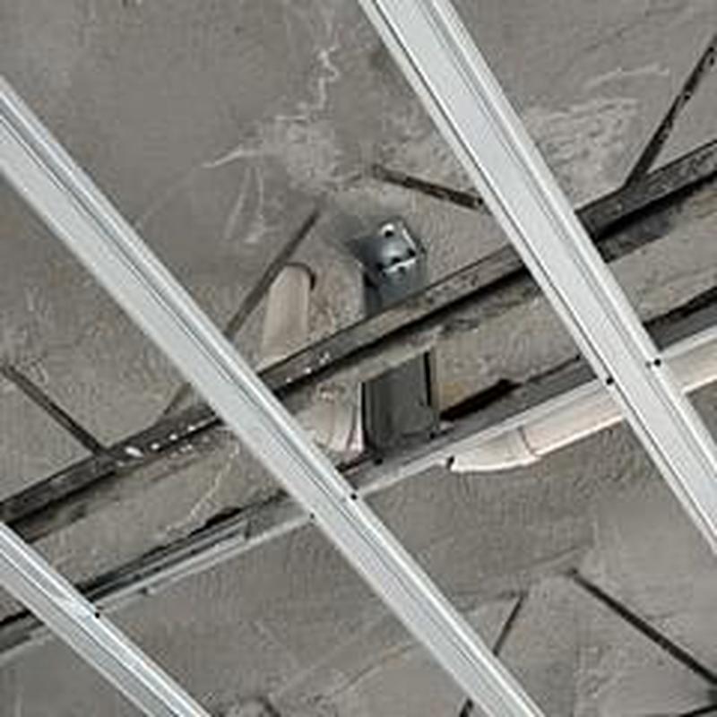 Drain lines under ceiling with metal supports