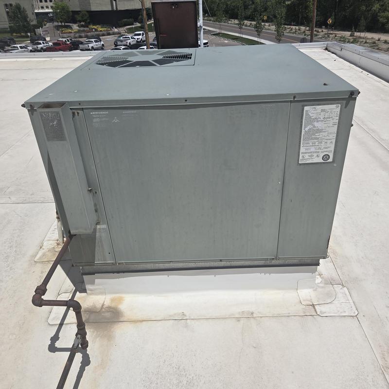 Rooftop packaged HVAC unit on commercial building roof Rooftop packaged HVAC unit on commercial building roof