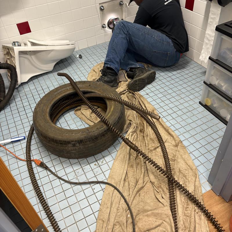 Main drain line cleaning with plumbing snake tool Main drain line cleaning with plumbing snake tool