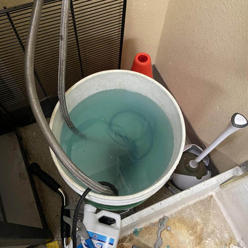 Tankless water heater flushing bucket with hoses Tankless water heater flushing bucket with hoses