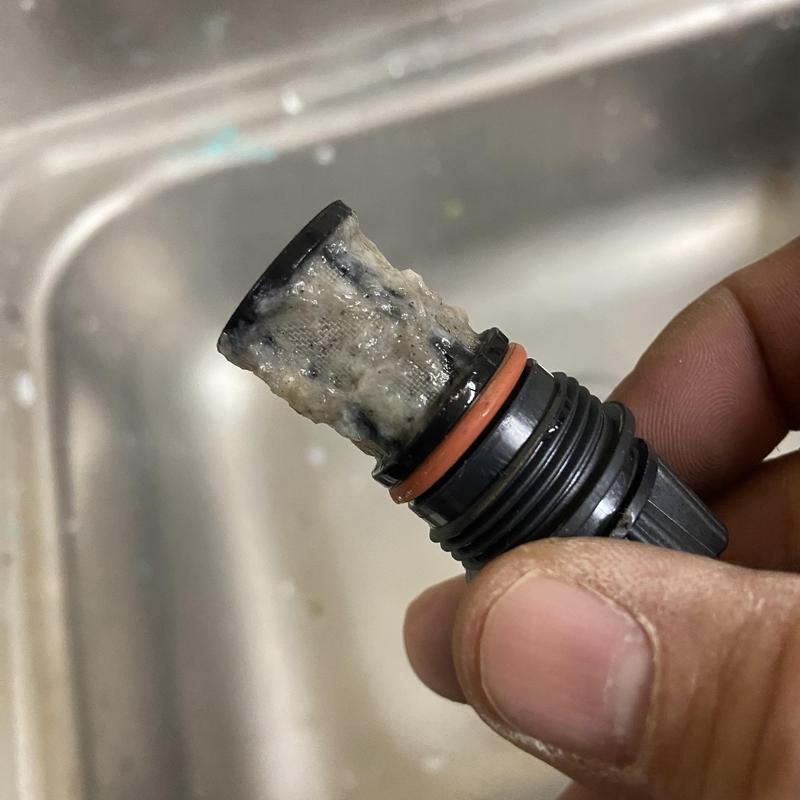 Tankless water heater flow sensor clogged with debris Tankless water heater flow sensor clogged with debris