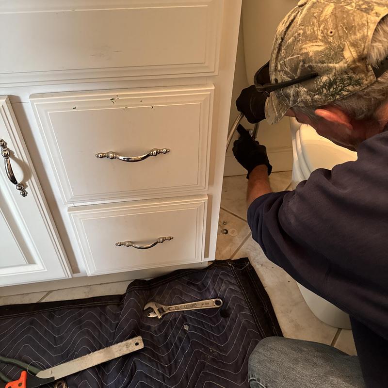 Toilet removal and resetting by plumber in bathroom Toilet removal and resetting by plumber in bathroom