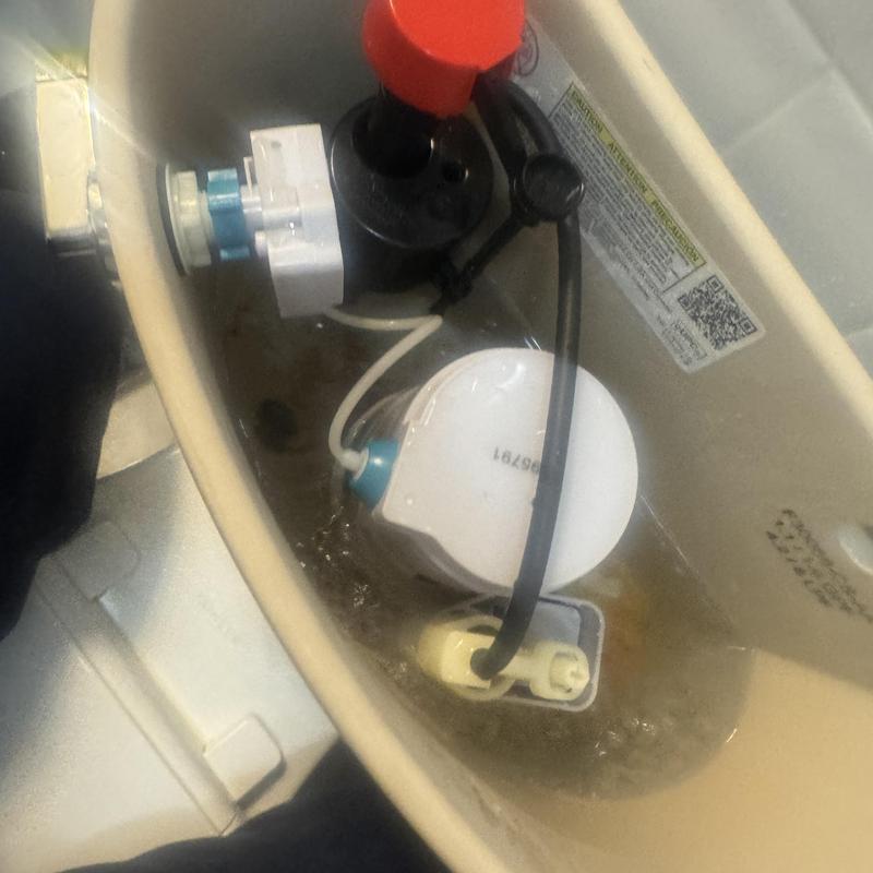 Toilet fill valve replacement inside tank with water flowing