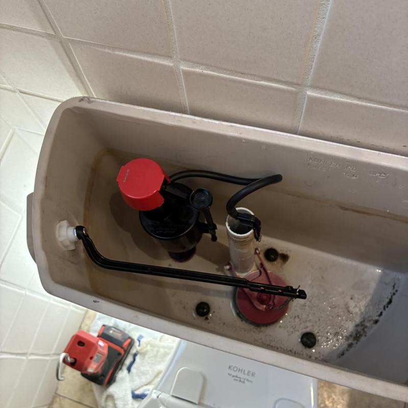 Toilet fill valve and flapper installation inside tank