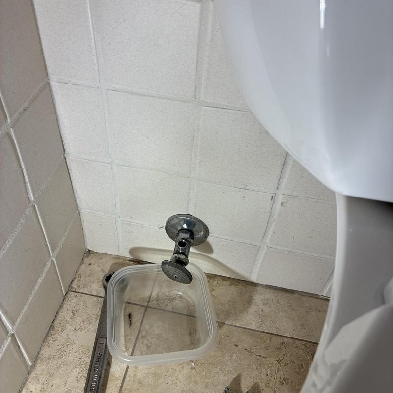 Toilet hot-side angle stop valve with catch basin