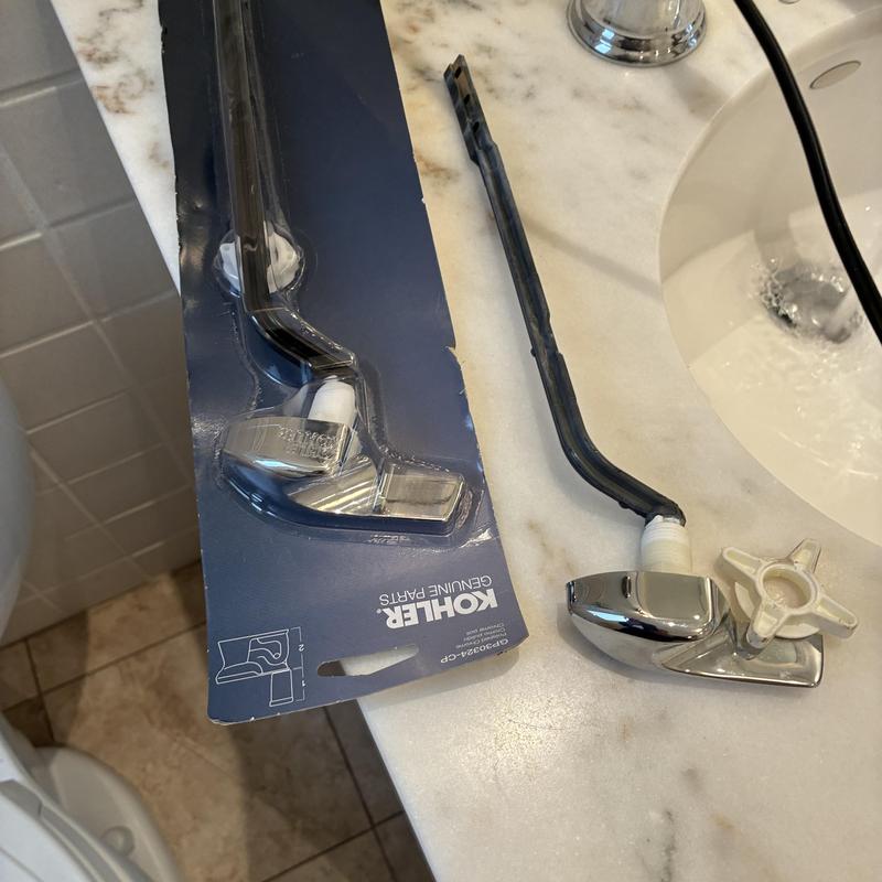 Toilet handle and supply line replacement parts on counter