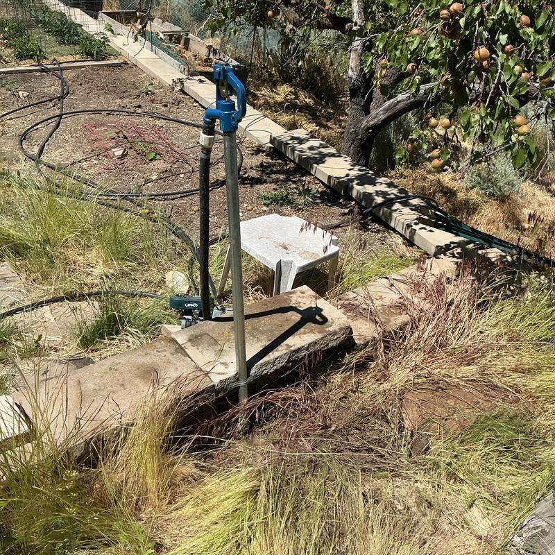 Yard hydrant installation with riser pipe and boiler drain