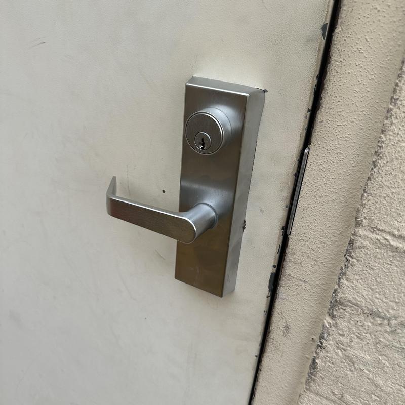 Exit device trim lock with stuck key on metal door