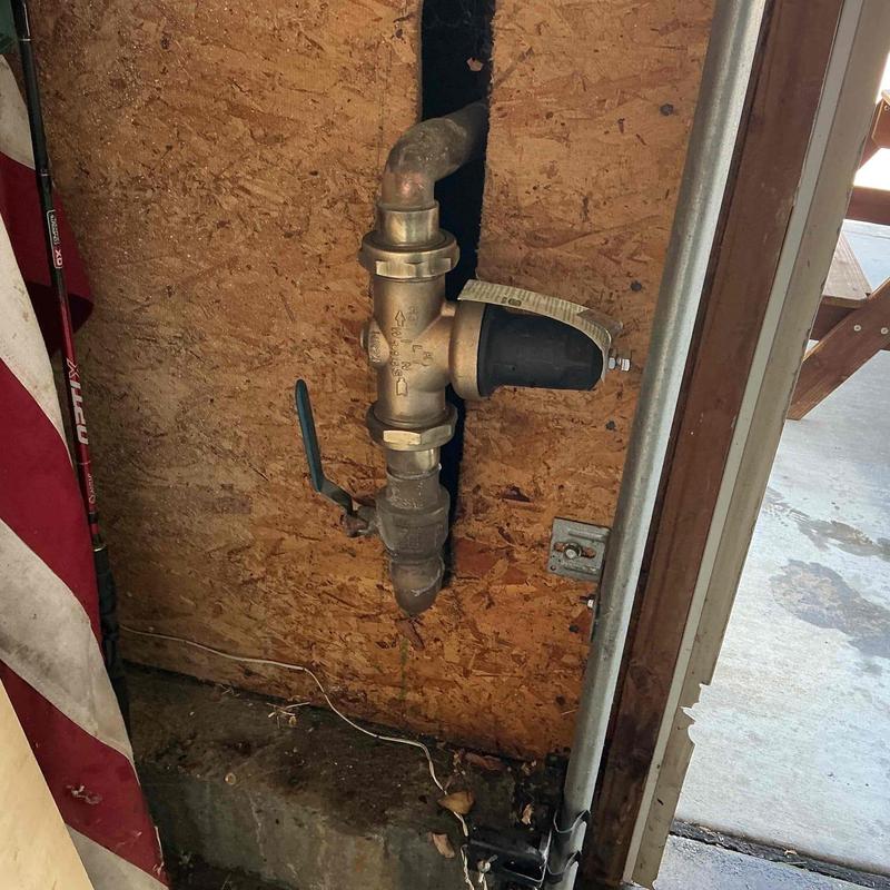 Pressure regulator valve with shutoff lever on wood panel