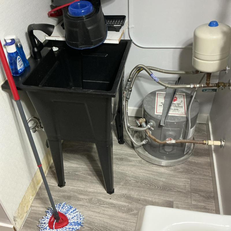 Utility sink and water heater removal for flooring replacement Utility sink and water heater removal for flooring replacement