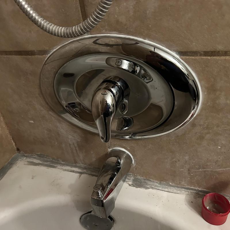 Tub spout and handle valve with soap residue buildup Tub spout and handle valve with soap residue buildup