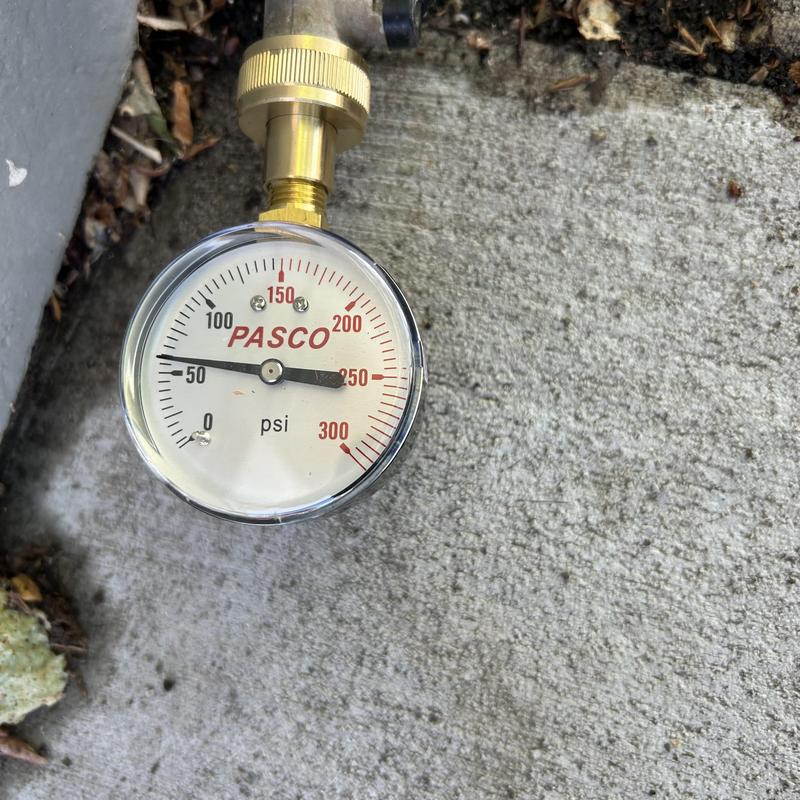 Pressure gauge on plumbing system showing pressure level Pressure gauge on plumbing system showing pressure level