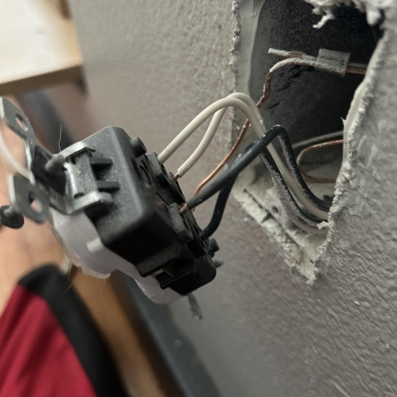 Backstab electrical receptacle with exposed wiring in wall Backstab electrical receptacle with exposed wiring in wall
