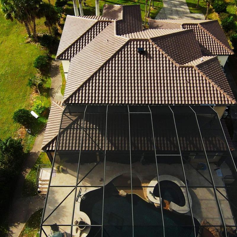 Concrete tile roof with screened pool enclosure in Punta Gorda Concrete tile roof with screened pool enclosure in Punta Gorda
