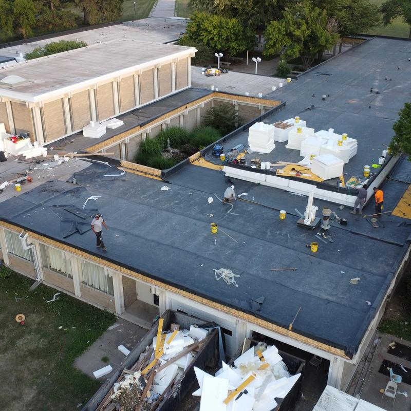 Polyiso insulation installation on flat commercial roof