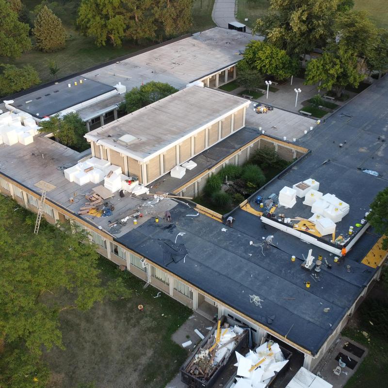 Polyiso insulation installation on flat roof system