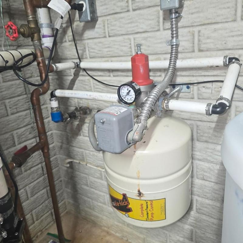 Well pressure tank with gauge and switch installation