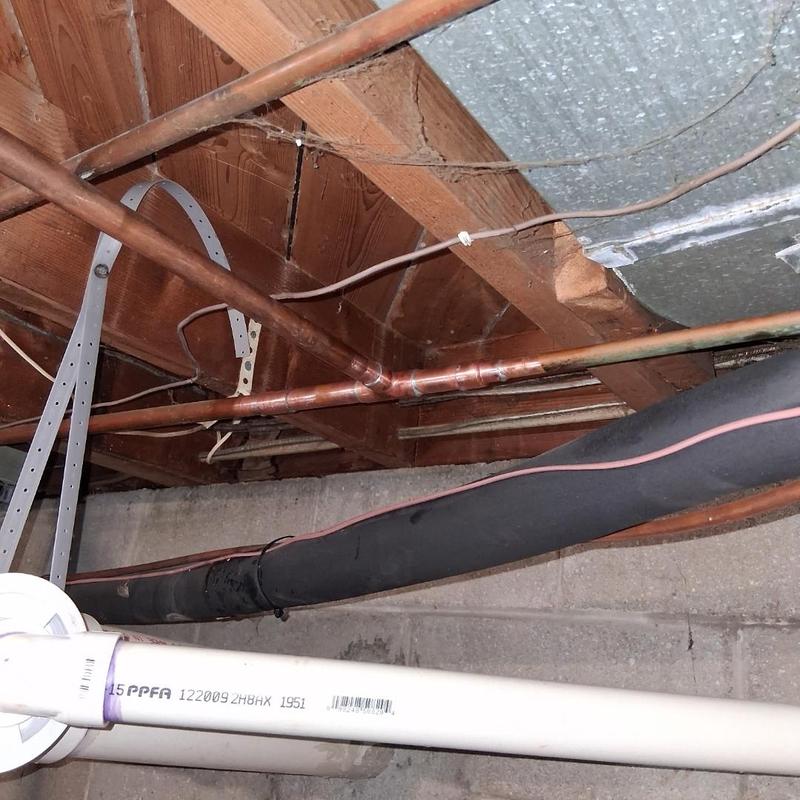 Copper piping installation under floor joists