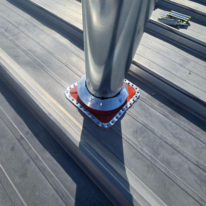 HT pipe boot installed on metal roof ridge HT pipe boot installed on metal roof ridge